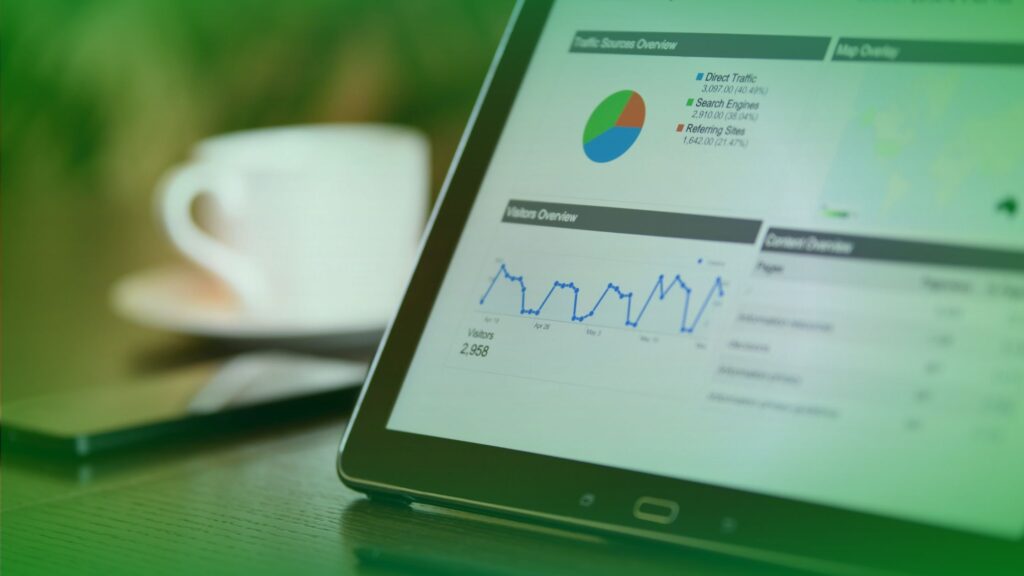 A close-up of a laptop screen showing upward-trending SEO growth and lead conversion metrics, illustrating how Digital Hunters focuses on pipeline over vanity metrics.